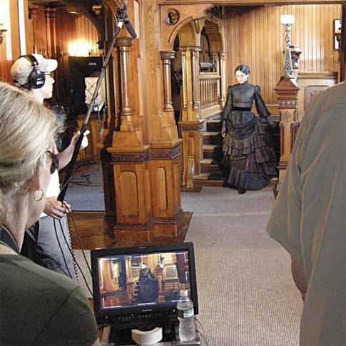 <span style="color: #000000 !important;font-size: 14pt">Janet Gardner directs re-enactor Victoria Haynes (Amelia Cooper Hewitt) in a scene from “Mechanic to Millionaire: The Peter Cooper Story”</span>