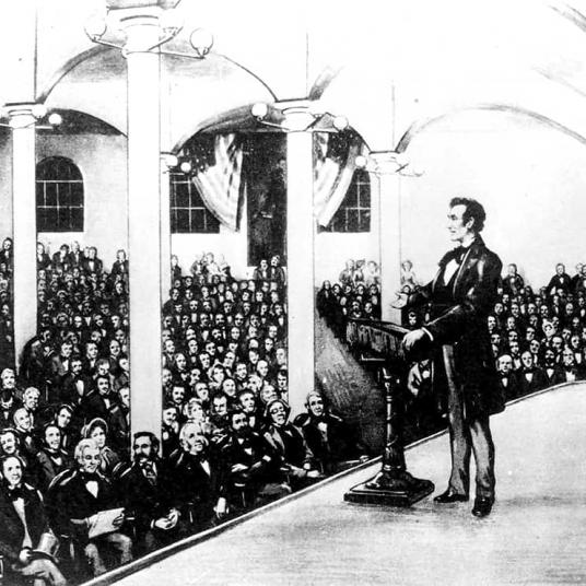<span style="color: #000000 !important;font-size: 14pt">Contemporary print showing Abraham Lincoln in Cooper Union’s Great Hall on February 27, 1860, delivering his speech which ended with, “Let us have faith that might makes right...” Artist unidentified</span>