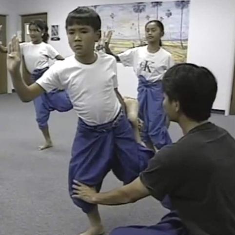 <span style="color: #000000 !important;font-size: 14pt">Thavro Phim instructing dancers</span>
