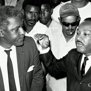 <span style="color: #000000 !important;font-size: 14pt">Bayard Rustin, a Quaker, introduces Dr. Martin Luther King to non-violent direct action.</span>