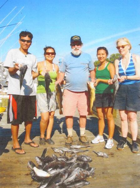 <span style="color: #000000 !important;font-size: 14pt">Sayon Soeun, Sophy Theam, George Morren, Sopheap Theam and Janet Gardner on a fishing trip.</span>